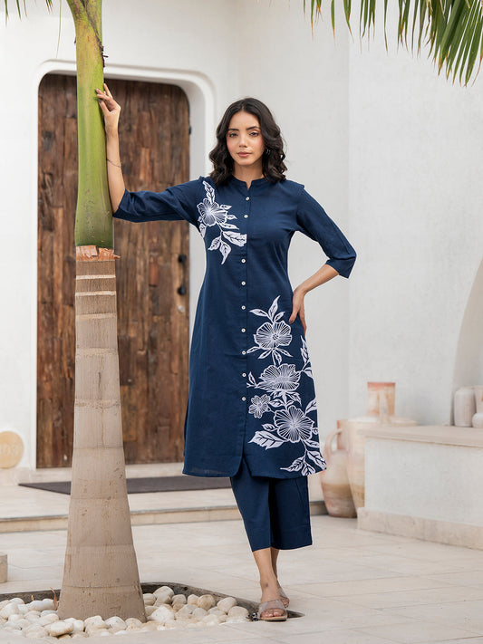 Navy blue floral printed cotton A-line fit kurta pant set worn by a woman