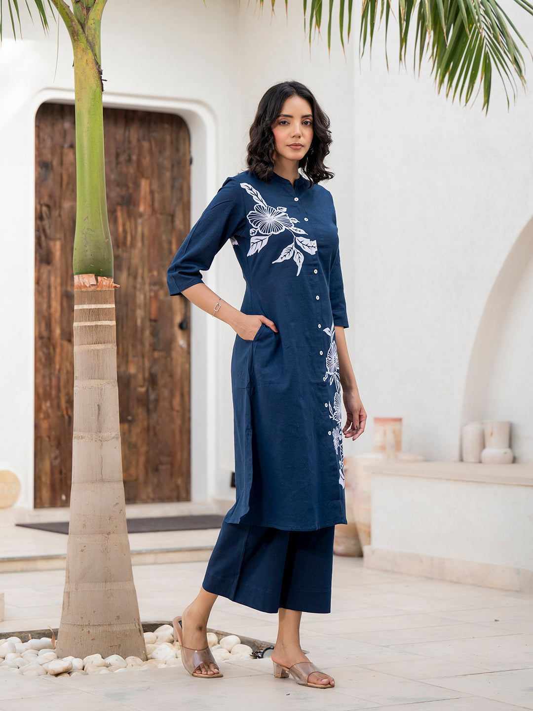 Navy blue floral printed cotton A-line fit kurta pant set with white embroidery