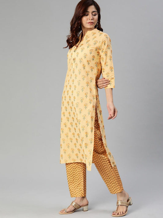 Yellow flower print cotton kurta set with patterned pants and stylish sandals