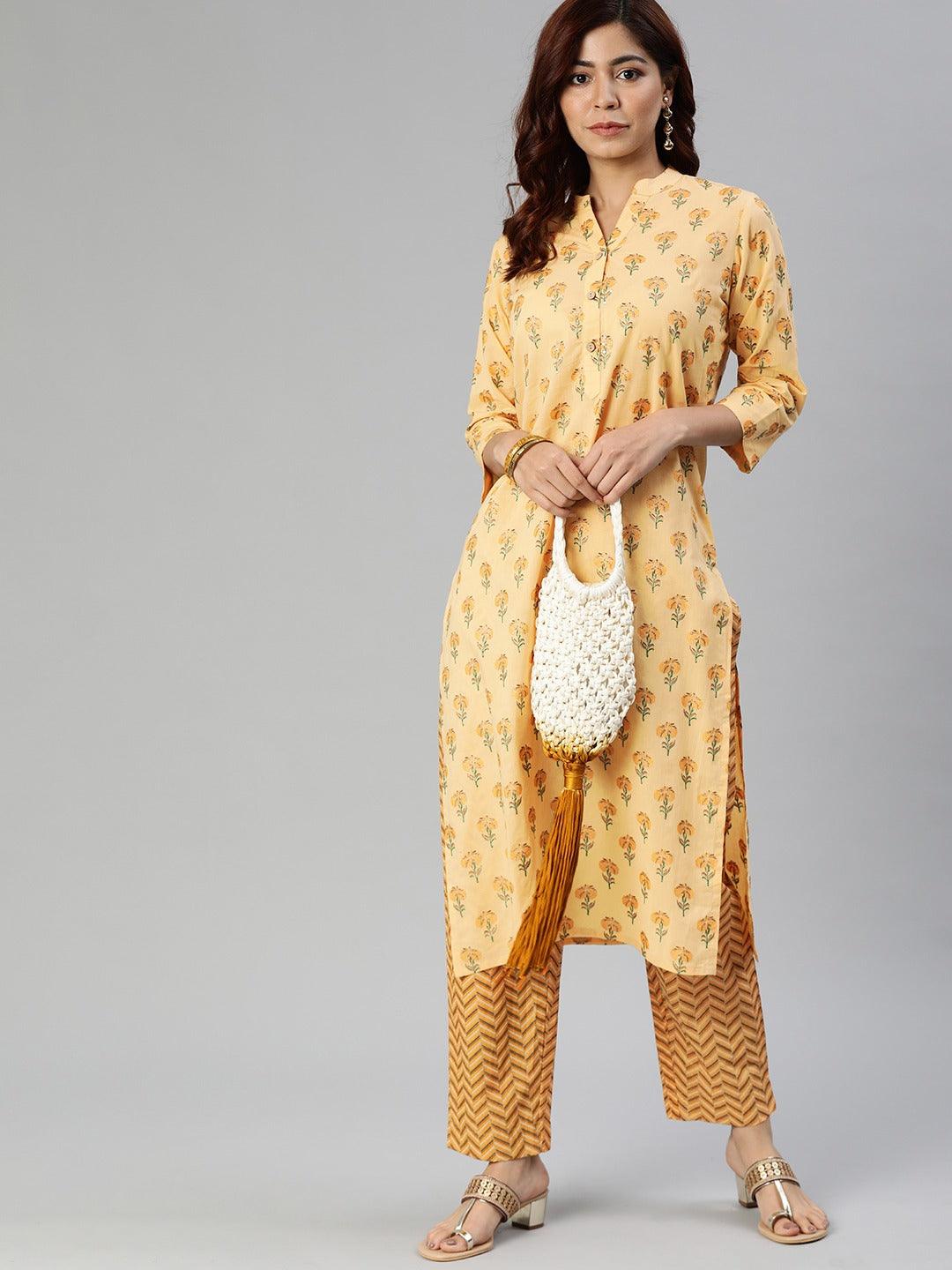 Yellow flower print cotton kurta set with patterned palazzo and white handbag