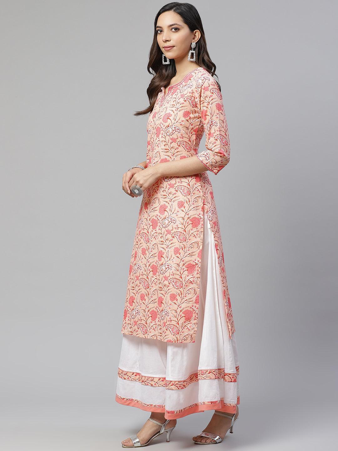 Woman in a Peach Cotton Kurta with Palazzo Set featuring a long pink floral design