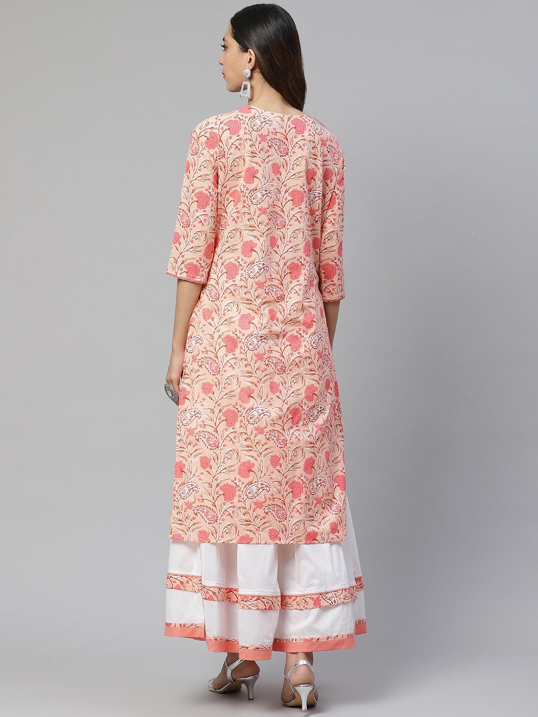 Woman wearing floral-printed Peach Cotton Kurta with white Palazzo Set from behind