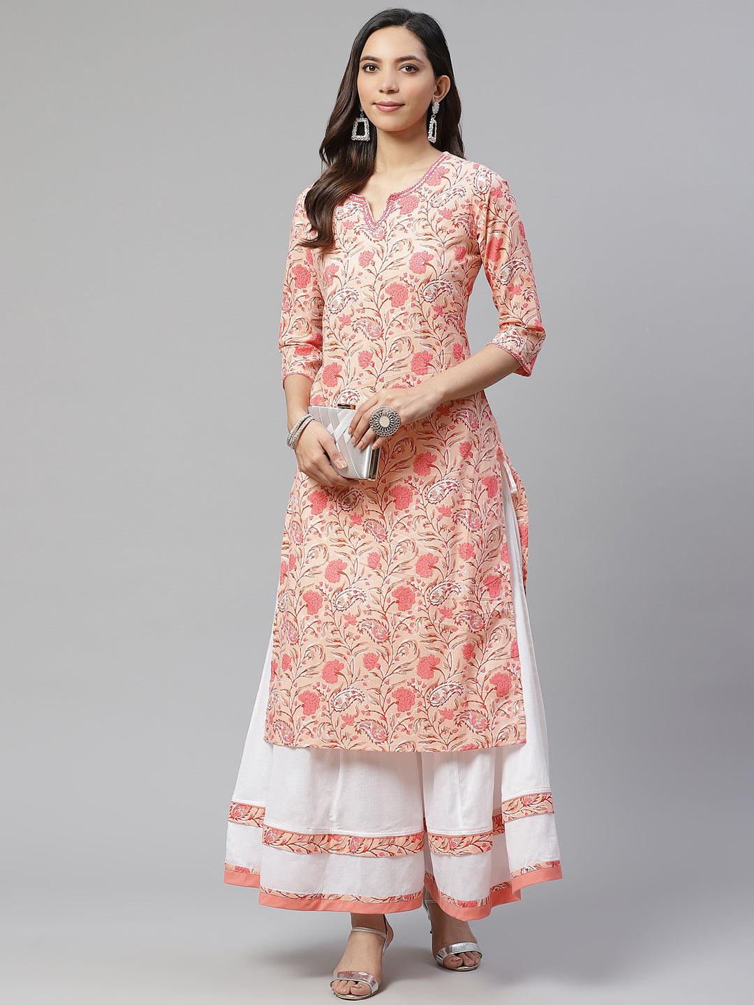 Woman in a pink floral kurta and white palazzo pants from a Peach Cotton Palazzo Set