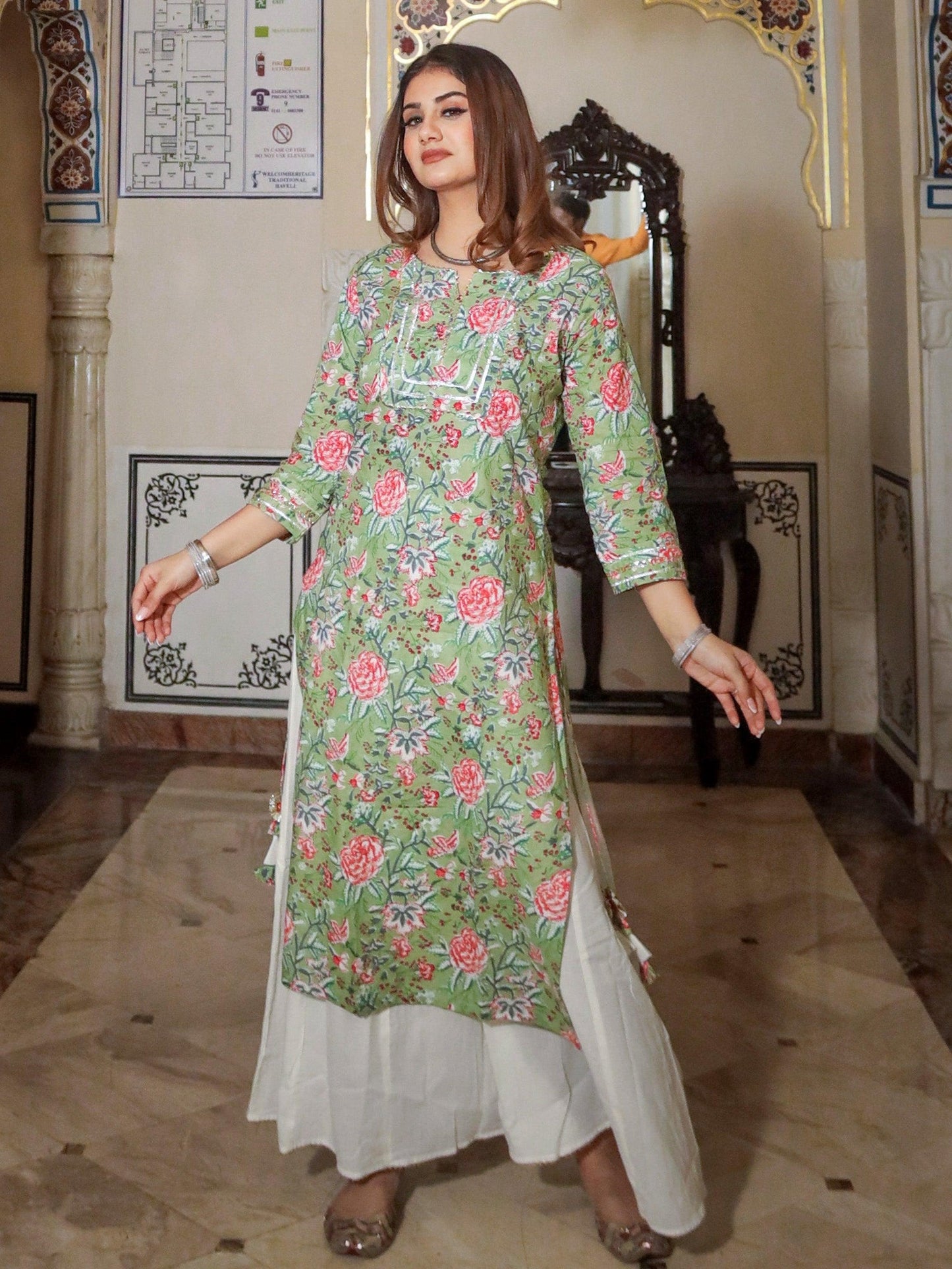 Floral-patterned green printed cotton kurta paired with a white skirt palazo set