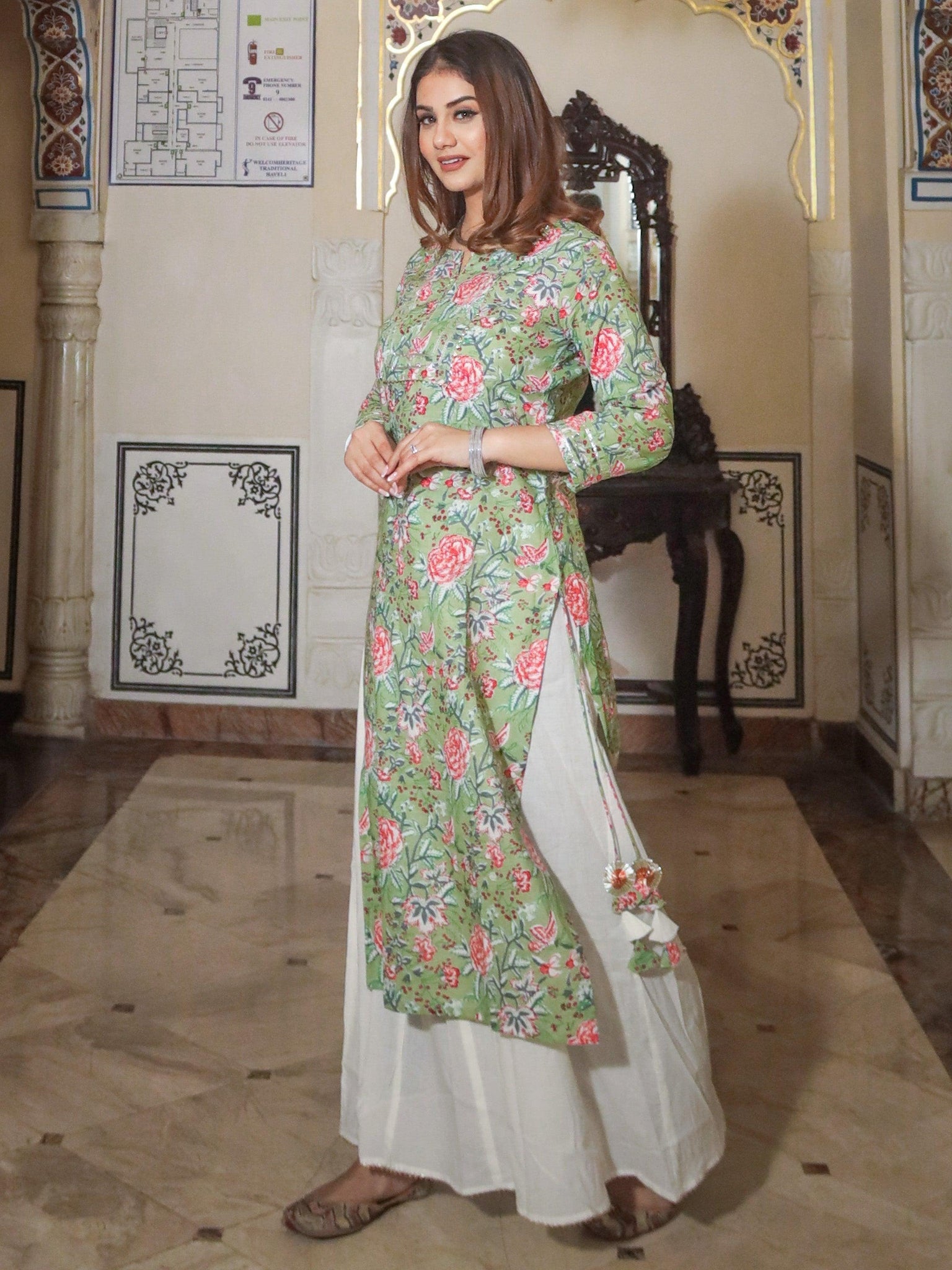 Floral print kurti with white palazo pant from the Green Printed Cotton Kurta Palazo Set