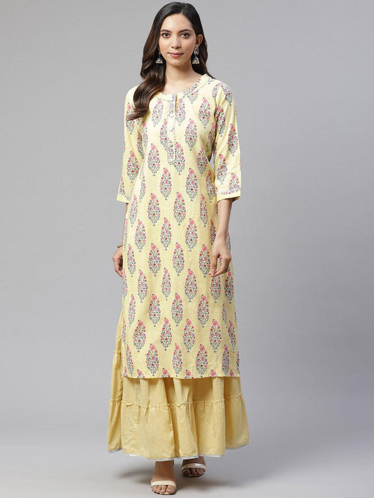 Yellow Rayon Printed Kurti worn over a plain yellow skirt in a stylish Kurti Sharara Set