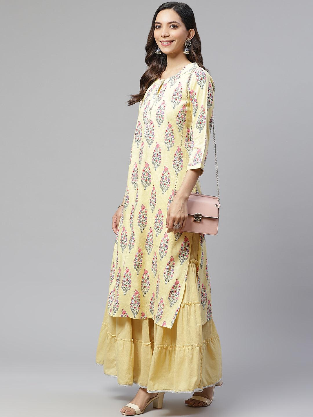 Woman in a yellow rayon printed kurti with matching skirt from the kurti sharara set