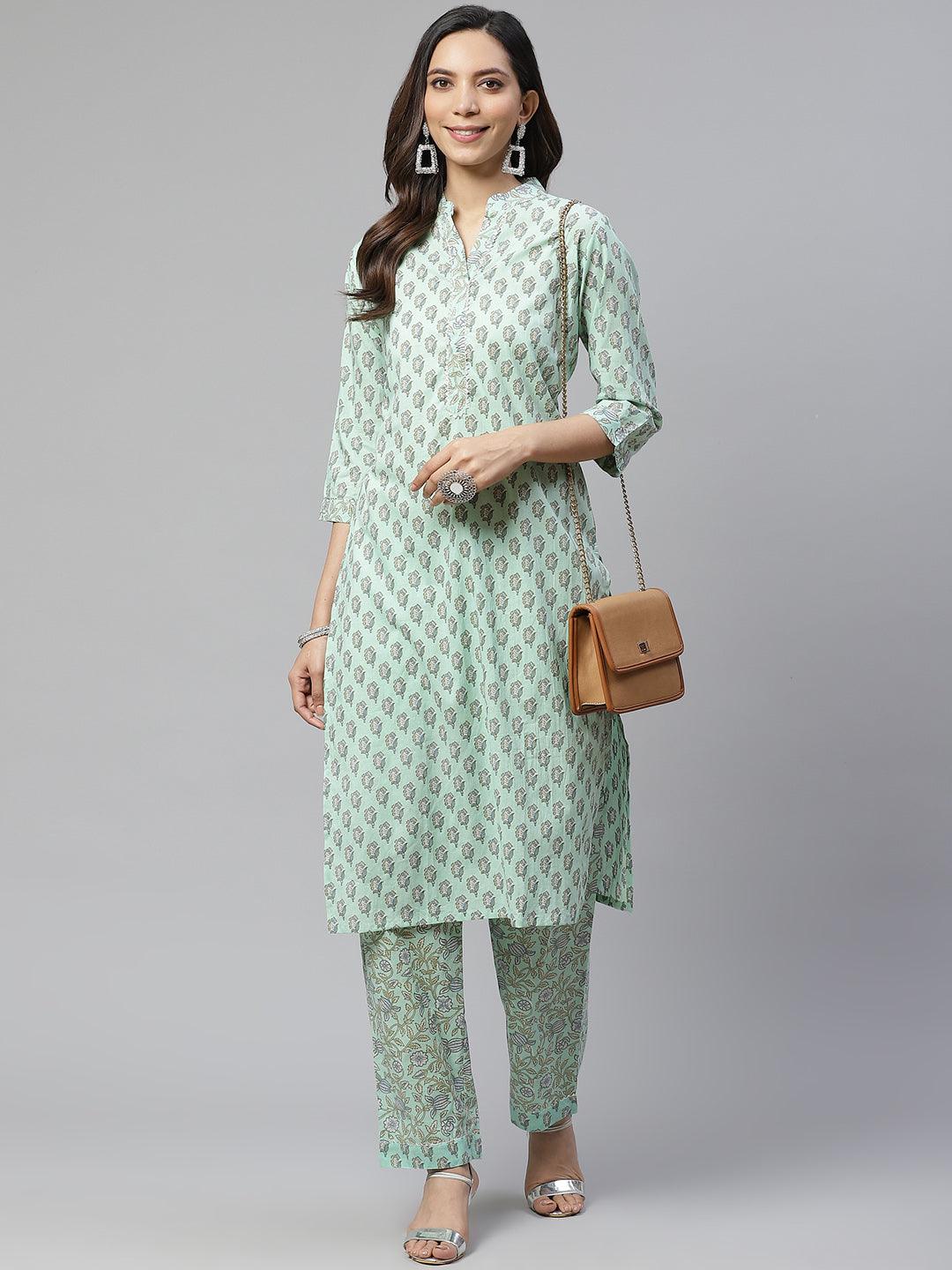 Mint green patterned kurti pant set with a brown shoulder bag for a stylish look