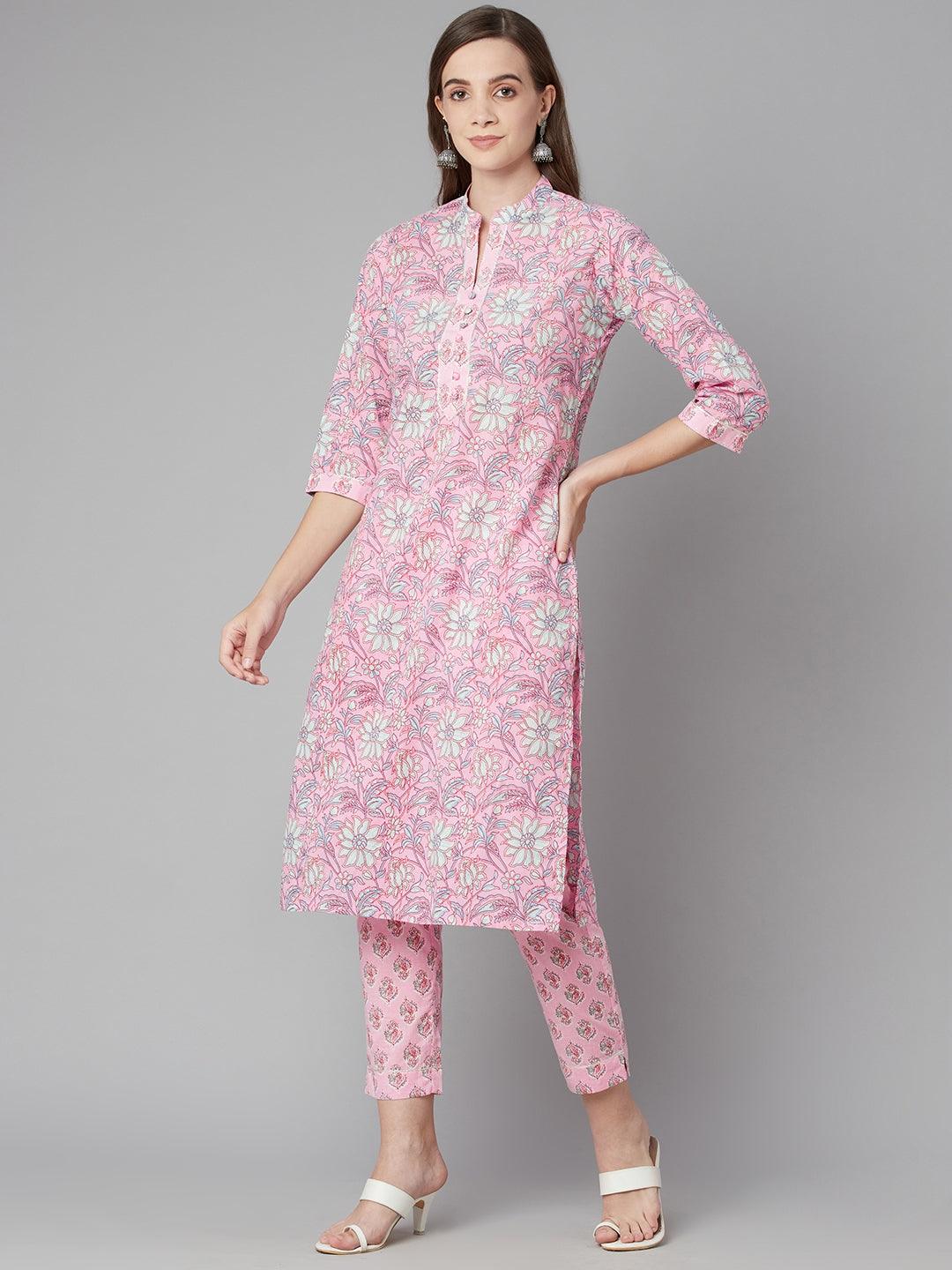 Woman wearing a Pink Floral Printed Cotton Kurta Pant Set for a stylish look