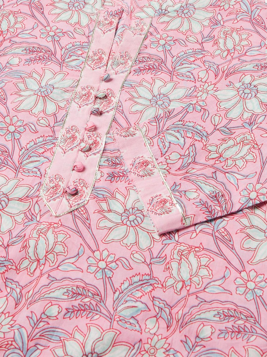 Pink floral printed fabric showcasing delicate flowers on a Kurta Pant set