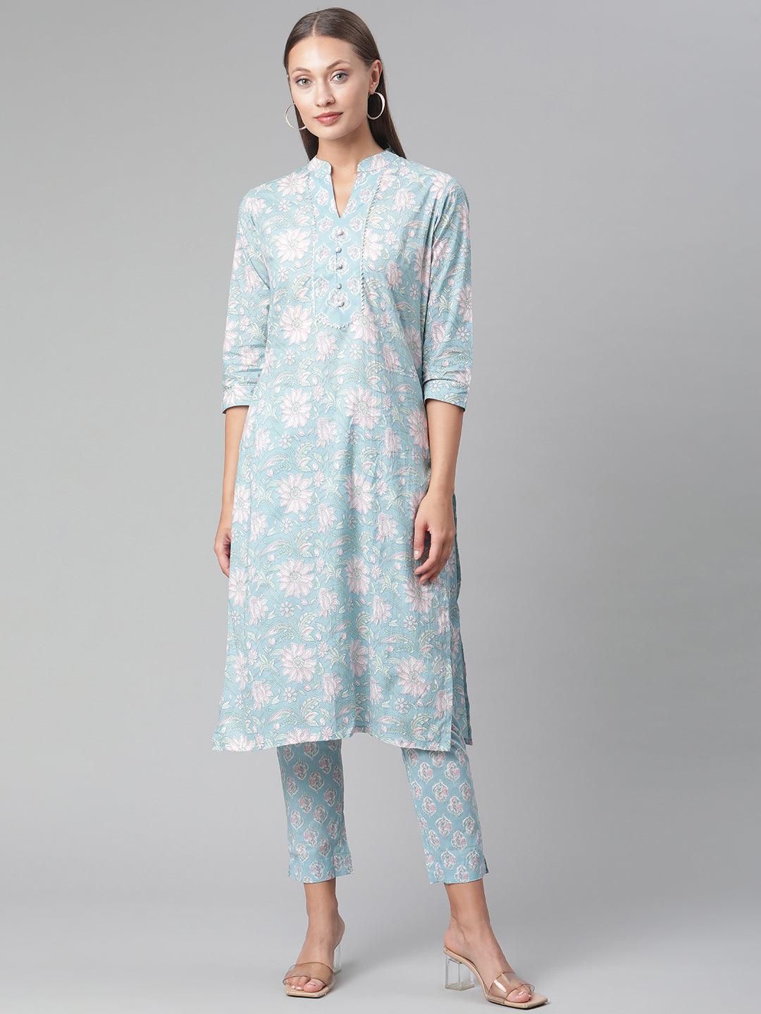 Light blue floral print cotton kurta pant set worn by a woman in stylish pose