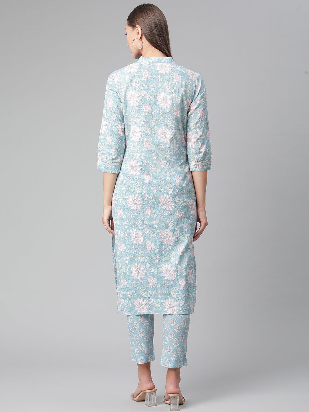 Woman wearing a Sky Blue Cotton Kurta Pant Set with floral print and three-quarter sleeves