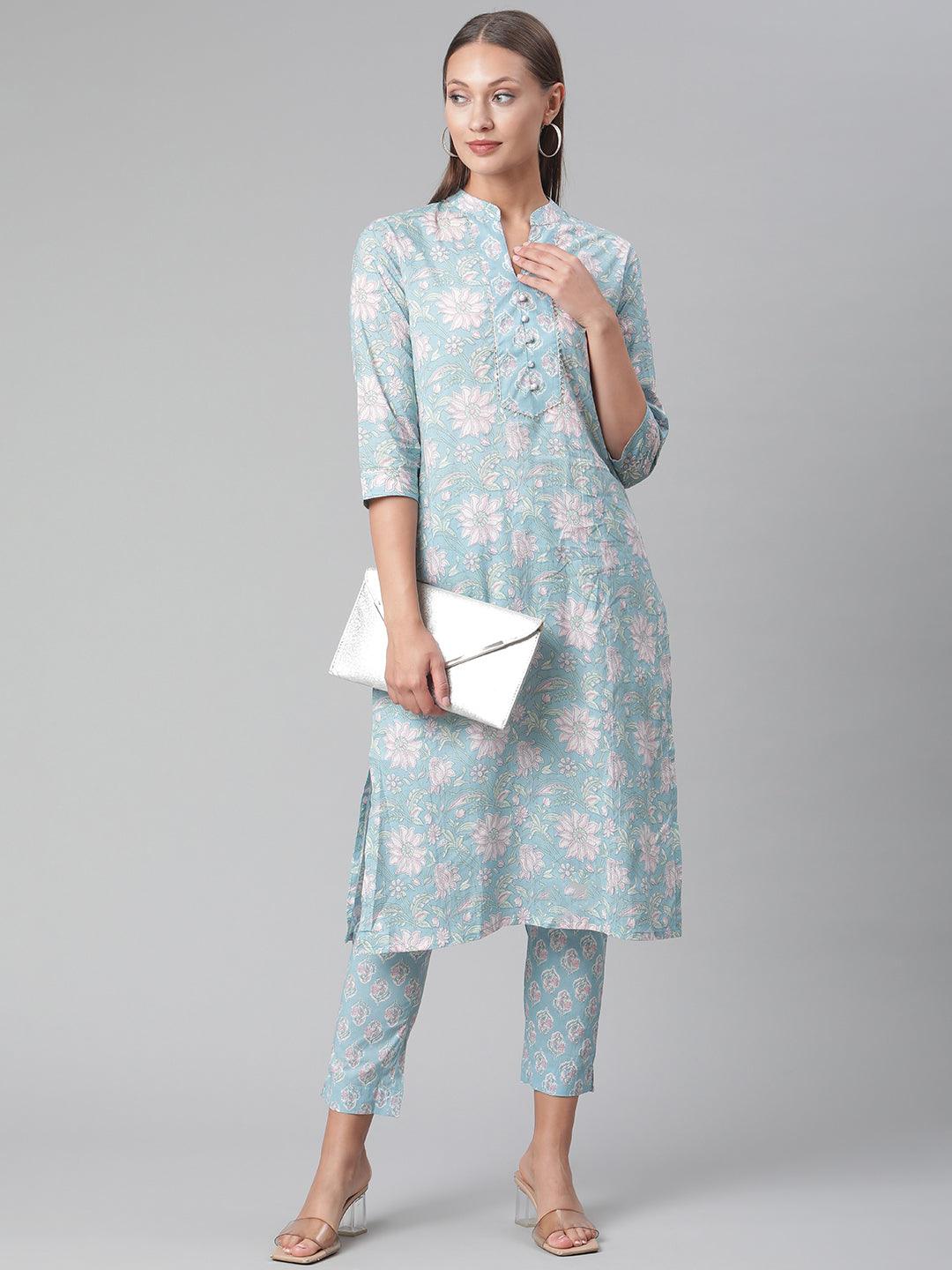 Light blue floral print cotton kurta pant set worn by a woman, showcasing stylish elegance