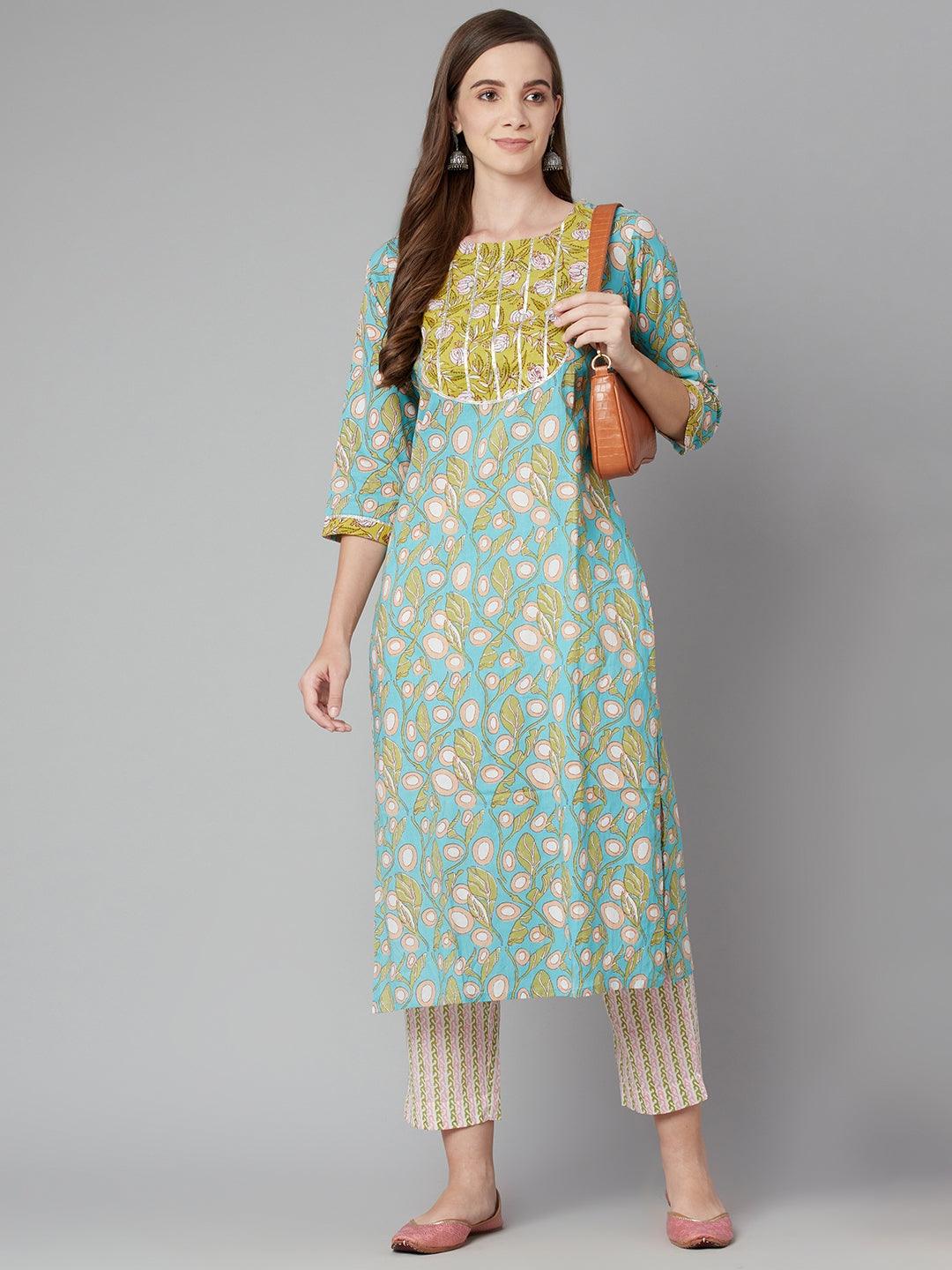 Woman in a sky blue floral printed cotton kurta pant set with yellow embroidery