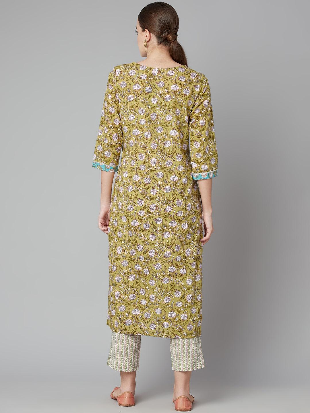 Pastel green floral printed cotton kurta pant set styled with three-quarter sleeves over white pants