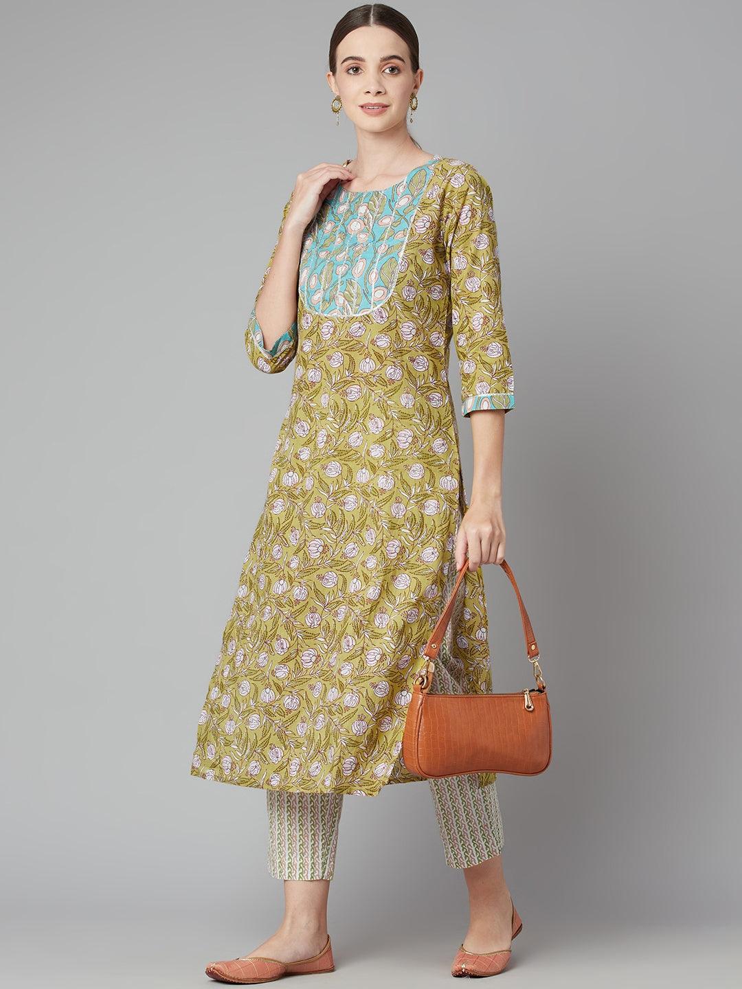 Pastel green floral printed cotton kurta pant set with matching pants and brown handbag