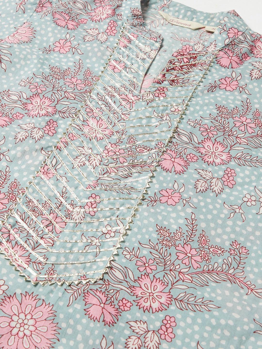 Pastel floral printed blouse with pink flowers on mint green polka dot background