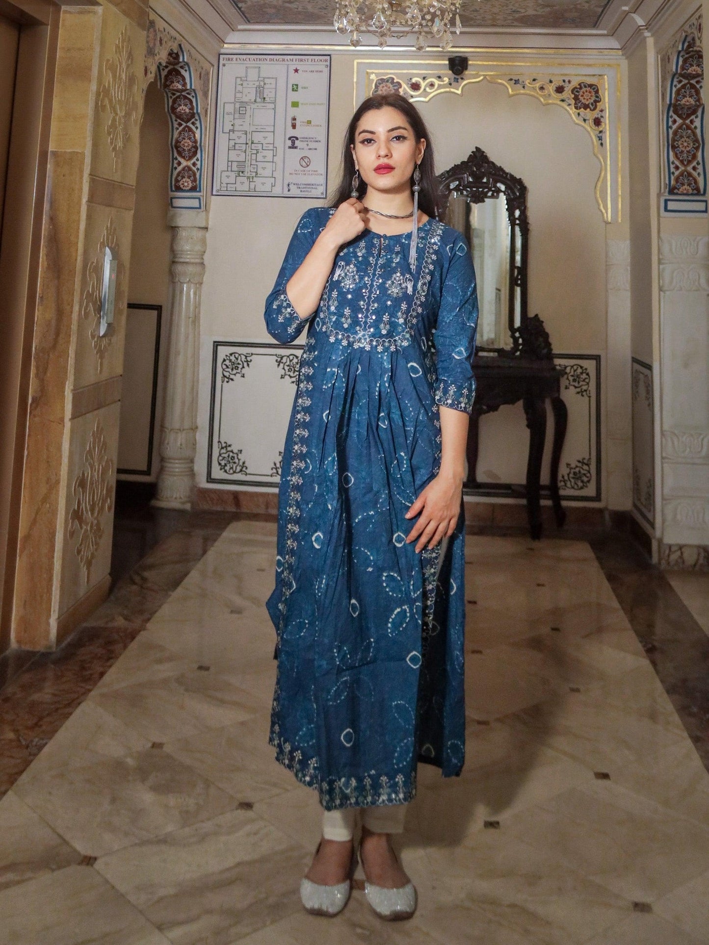 Woman in Blue Cotton Nyra Cut Kurta Pant Set with Embroidery and Three-Quarter Sleeves