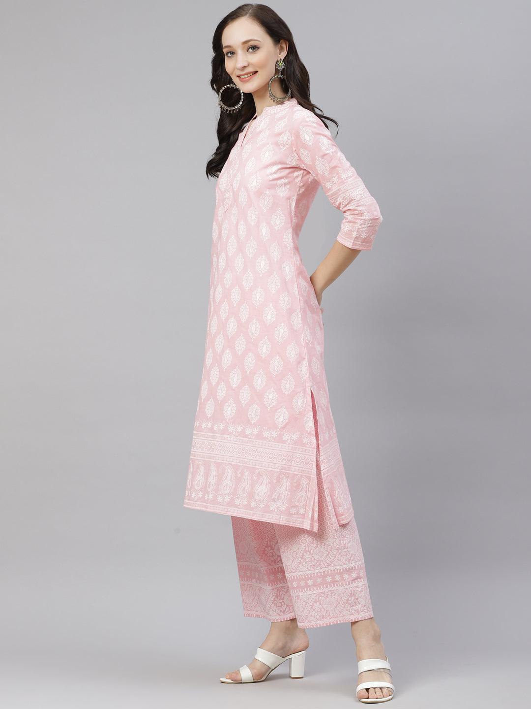 Pink floral-patterned kurta and palazzo set worn by a woman.