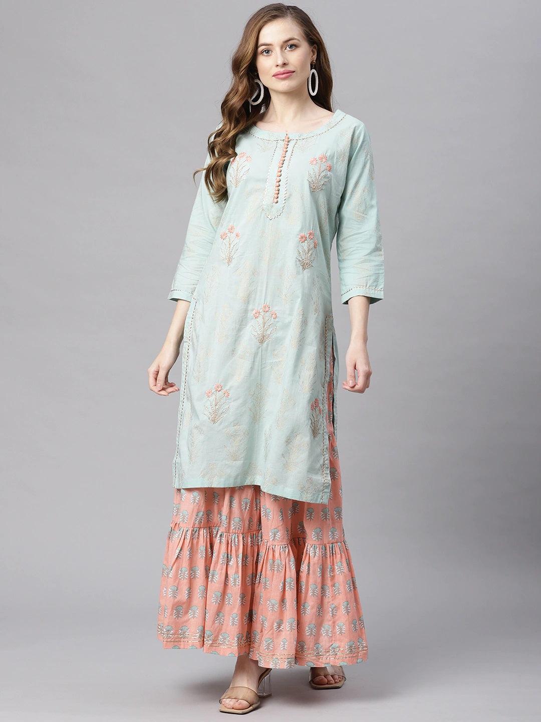 Woman in a light blue floral kurta and pink skirt from Sea Green & Peach Cotton Kurta Sharara Set