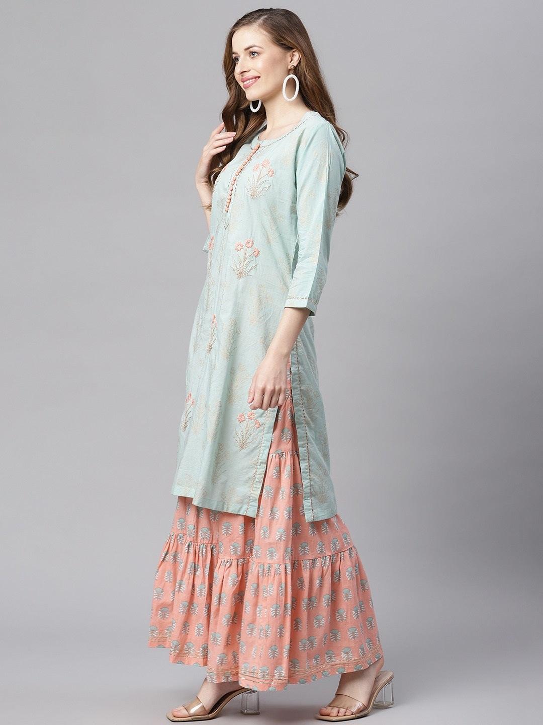 Woman in light blue kurta over pink patterned skirt from Sea Green & Peach Cotton Kurta Sharara Set