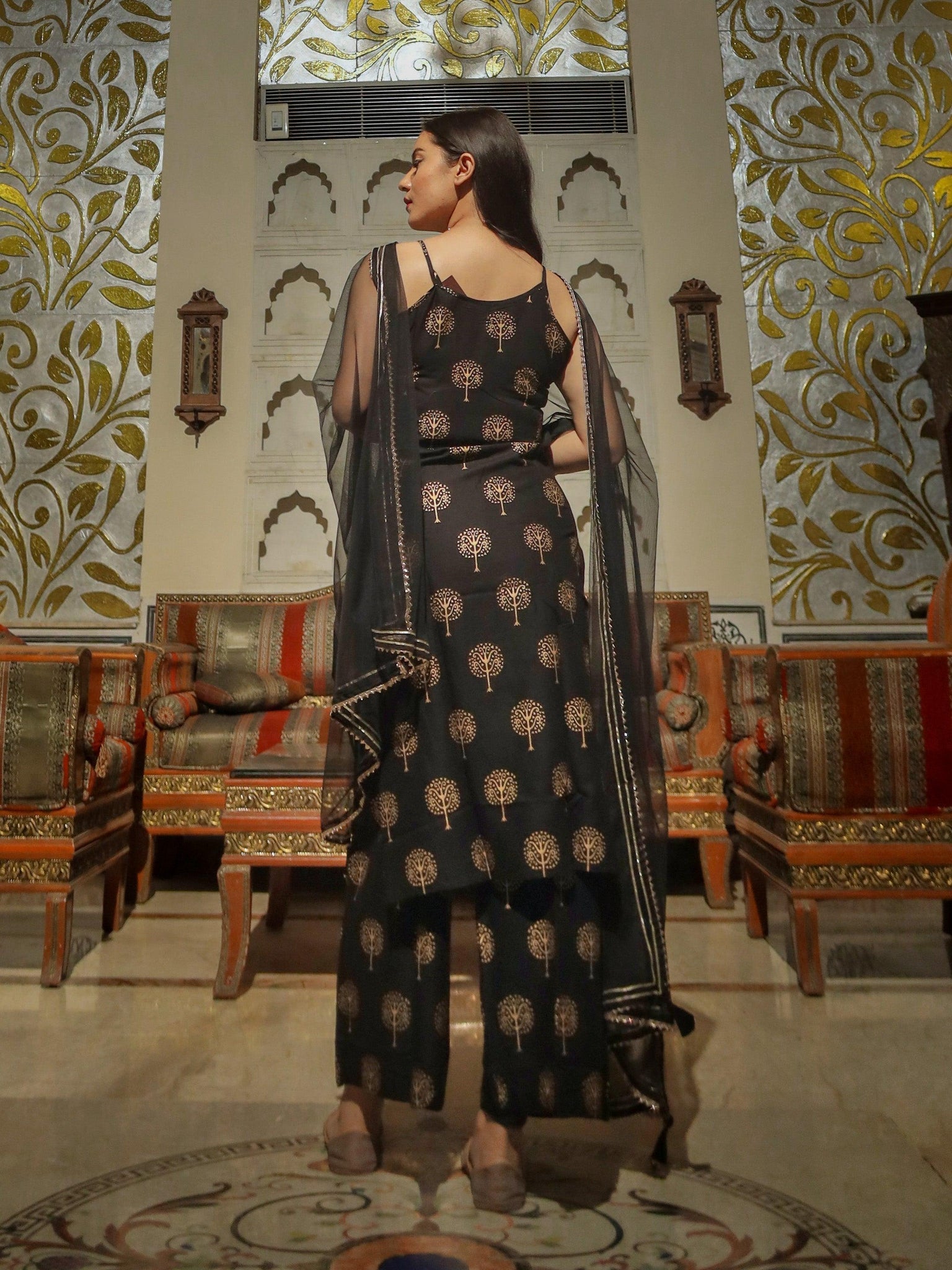 Ornate black and gold patterned shoulder strip kurta palazoo set with sheer dupatta