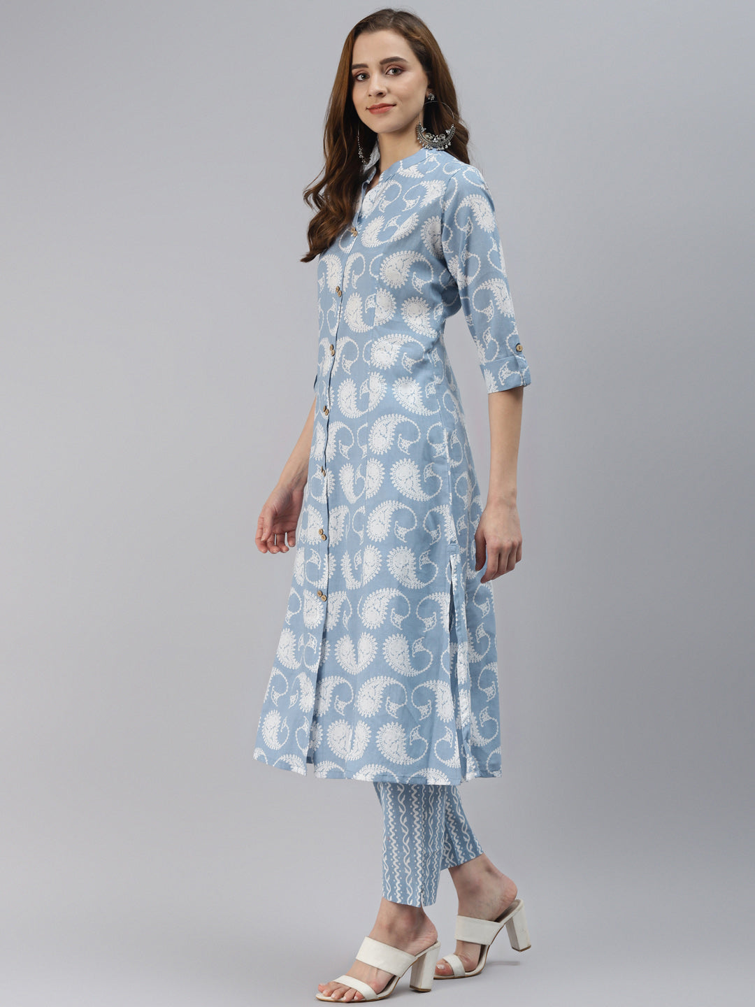 Light blue floral kurta with three-quarter sleeves over striped palazzos for women