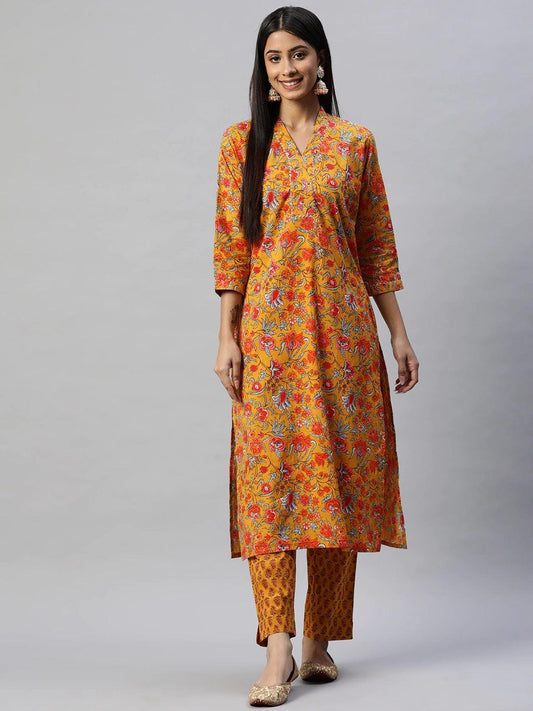 Smiling woman in Mustard Cotton Floral Printed Kurta Pant Set showcasing vibrant design