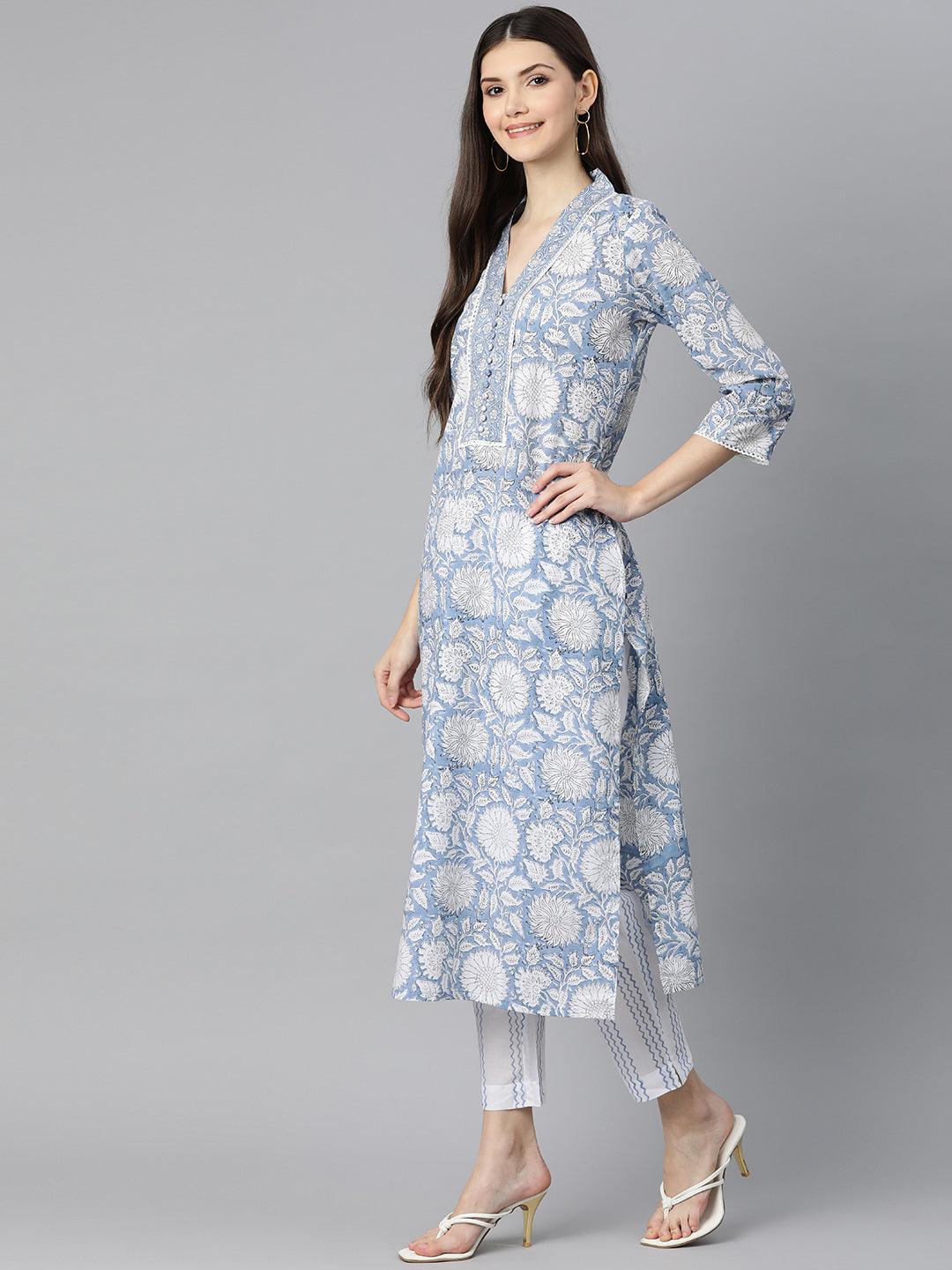 Floral-patterned sky blue hand block printed kurta pant set worn by a woman