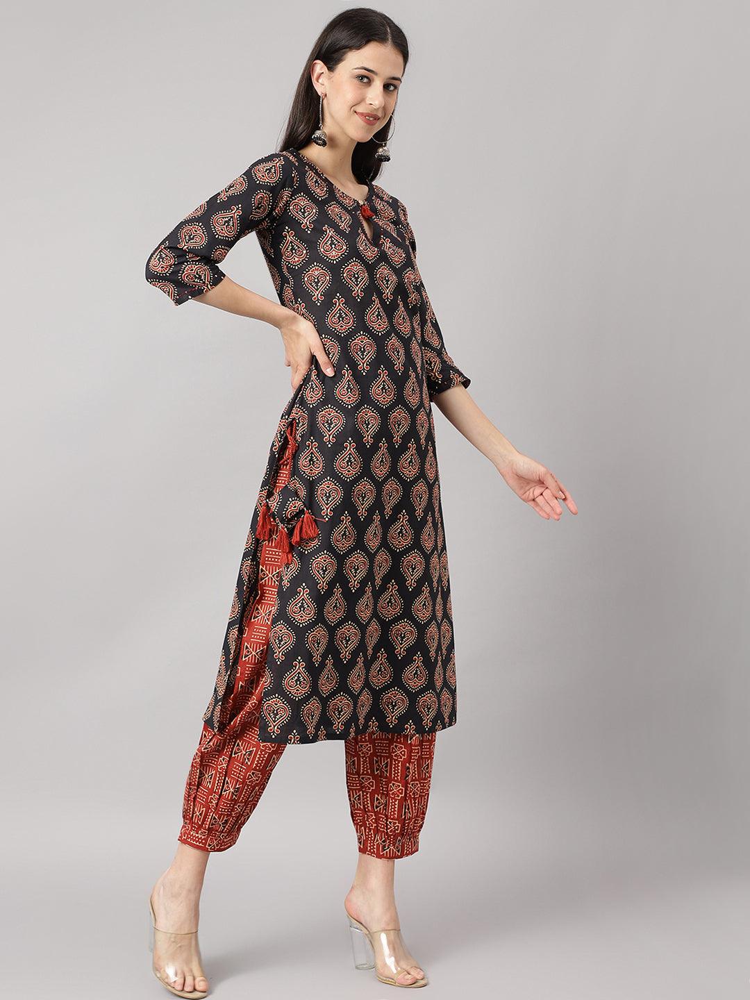 Woman posing in Black and Red Cotton Buti Printed Kurta with Cuffed Pant Set