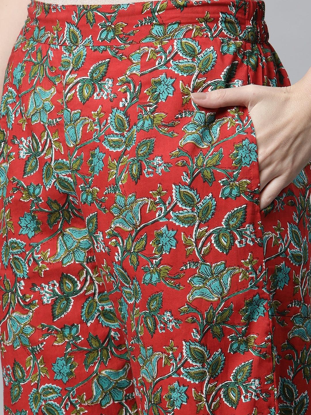 Floral-patterned red skirt with green leaf designs in Rama Green Cotton Straight Kurta Pant Set