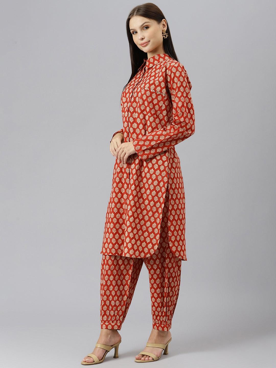 Woman in a red and gold shirt style kurta and cuffed pant co-ord set outfit