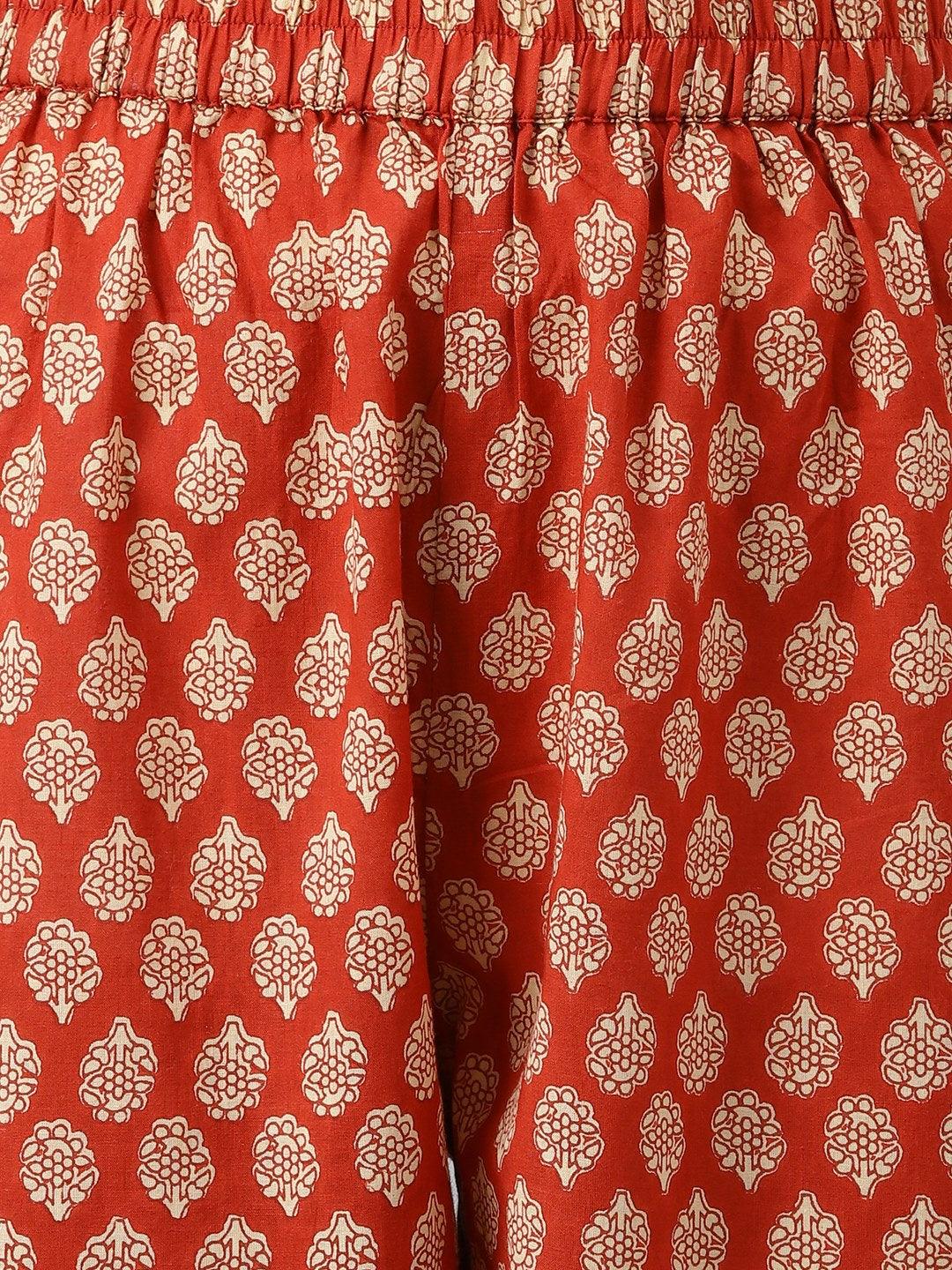 Red fabric featuring a white floral pattern for a Cotton Shirt Style Kurta Cuffed Pant Co-ord