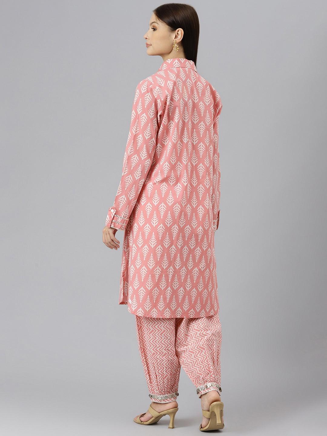 Woman in pink patterned shirt style kurta and hem cuffed pant co-ord set, back view