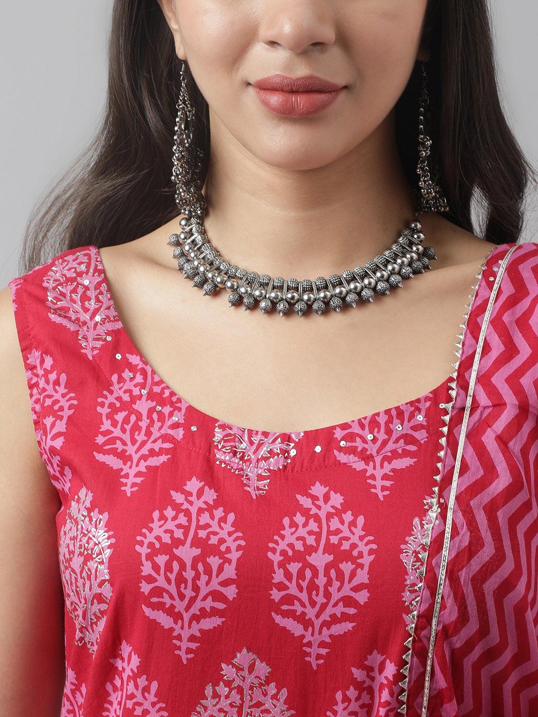 Ornate silver necklace and earrings paired with Magenta Floral Cotton Anarkali Kurta Pant Set