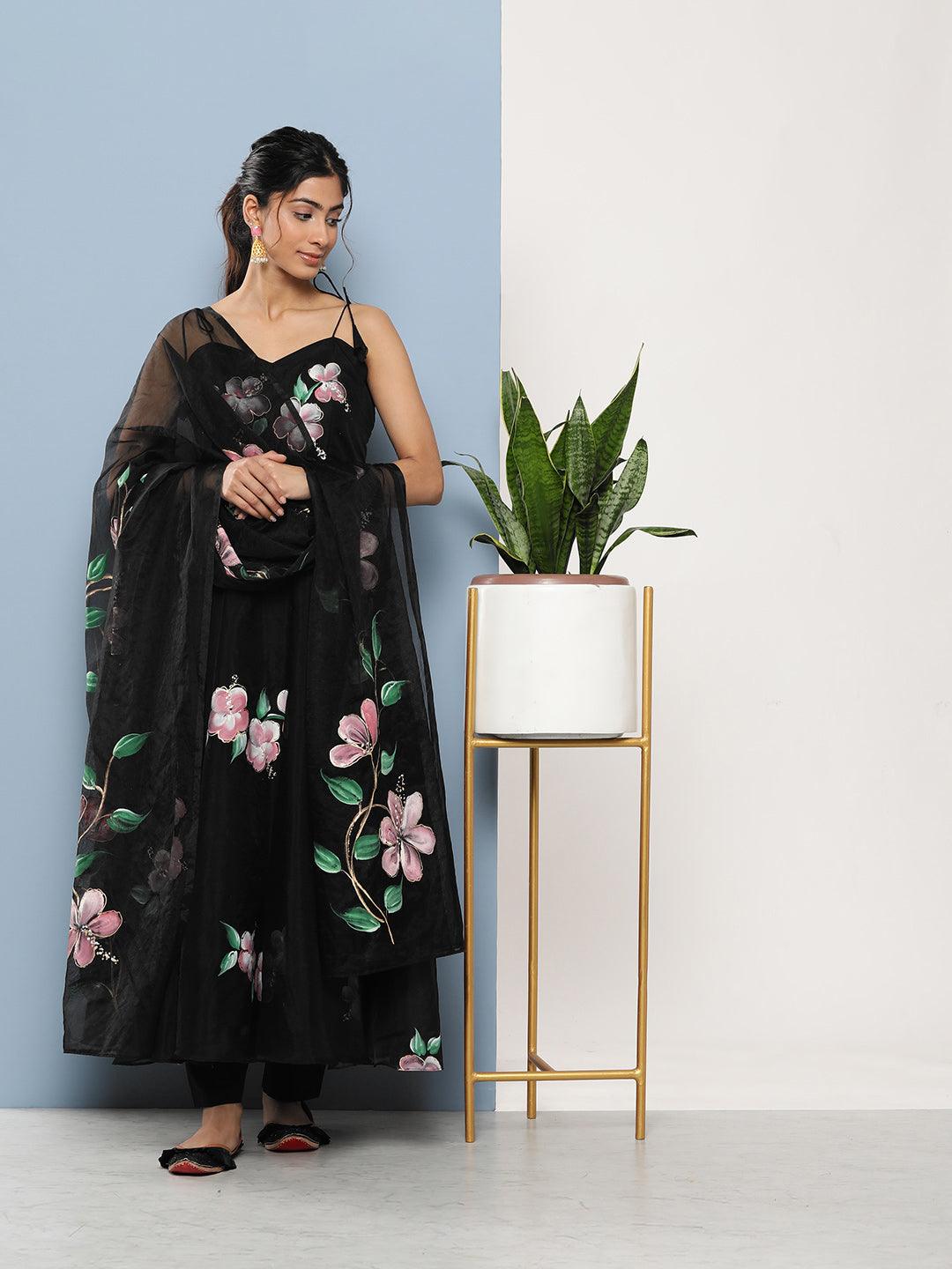 Floral black maxi dress featuring pink patterns on a woman wearing Anarkali Kurta