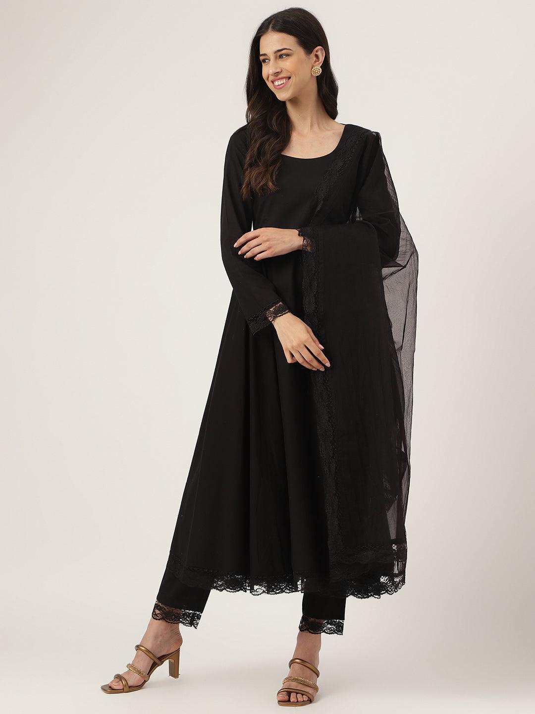 Smiling woman in a black solid Anarkali kurta with sheer sleeves for stylish wear