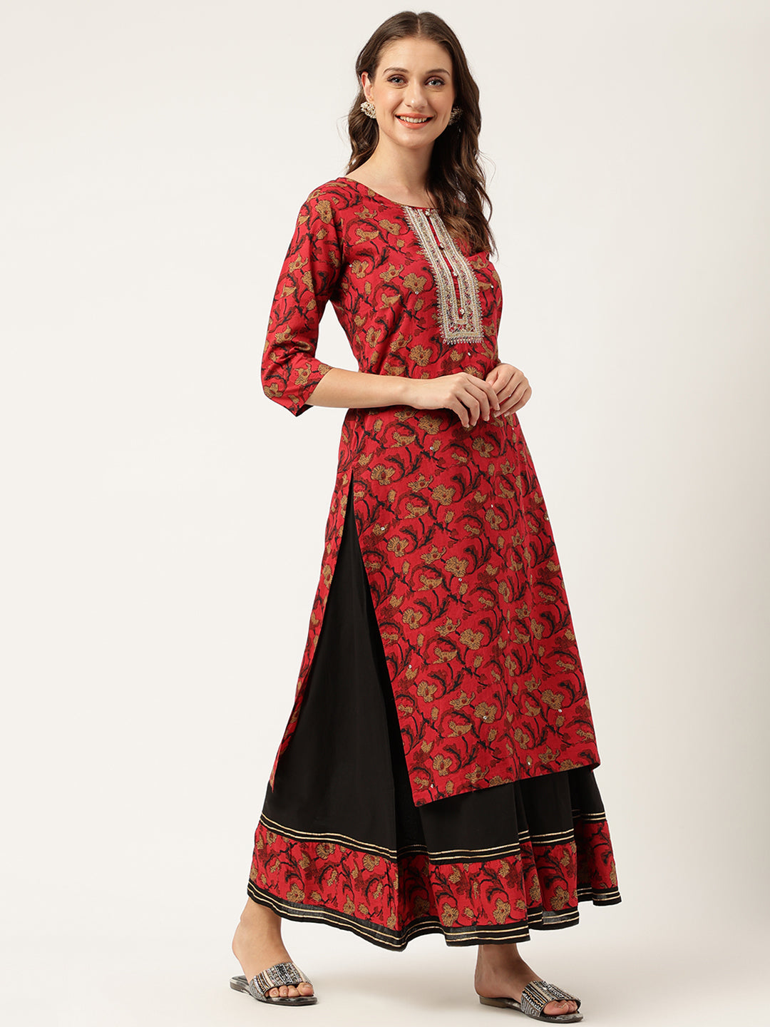 Red and gold floral printed cotton kurta with embroidered neckline over a black skirt