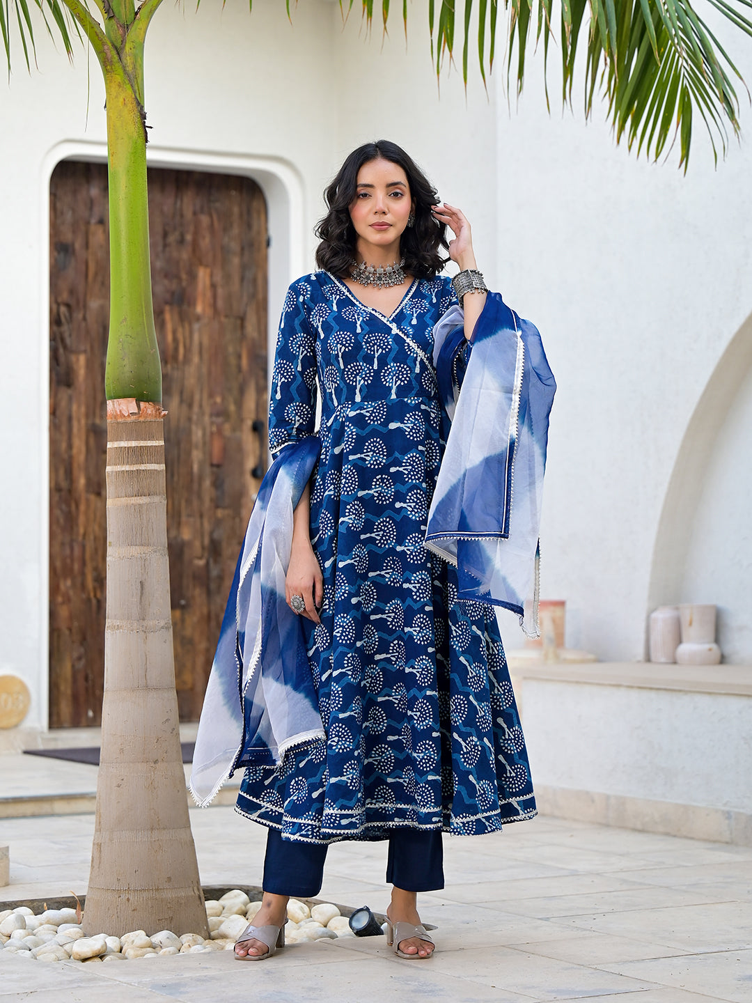 Woman wearing Indigo Blue Handblock Print Cotton Anarkali Kurta Set by a palm tree