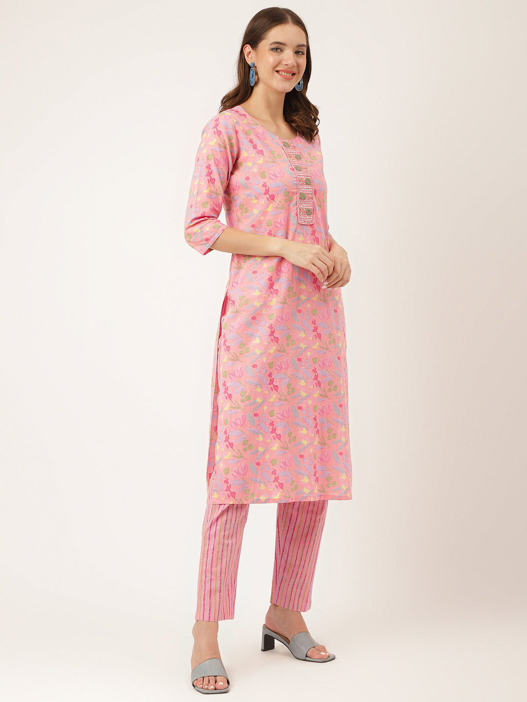 Pink floral print cotton kurta with three-quarter sleeves worn over striped pants