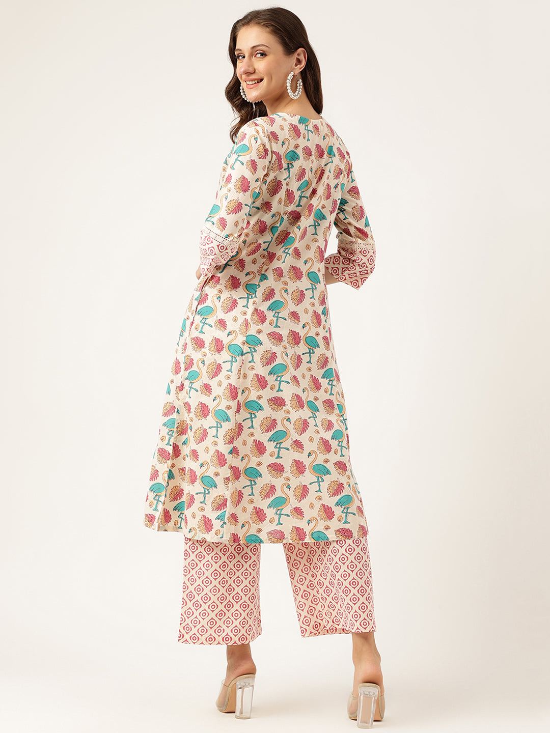 Woman wearing a Floral Cotton Kurta with Trouser set featuring a vibrant floral print