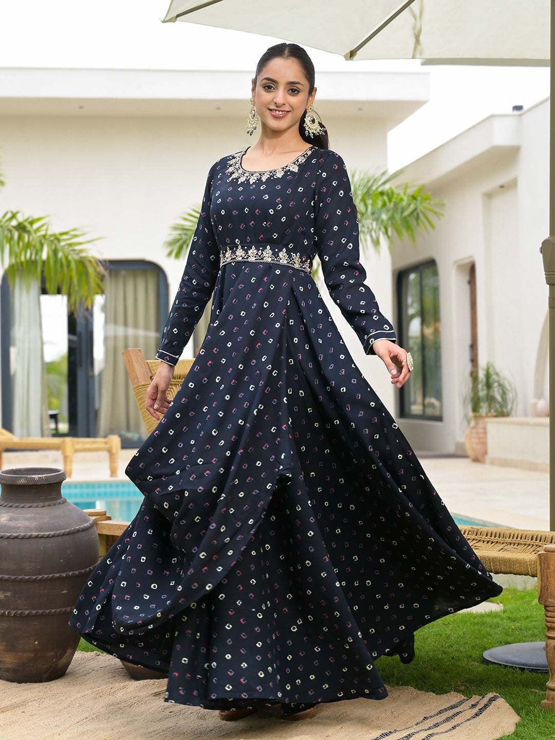 Long flowing navy blue bandhani print flared dress with embroidered waistband and belt