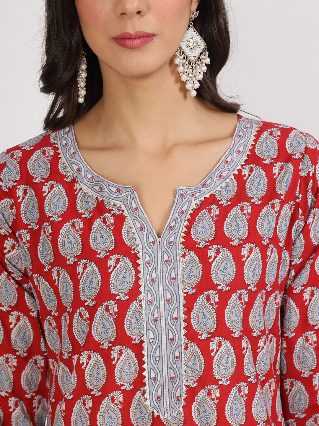 Red and silver patterned kurti with earrings from Maroon Paisley Print Cotton Kurta Pants set