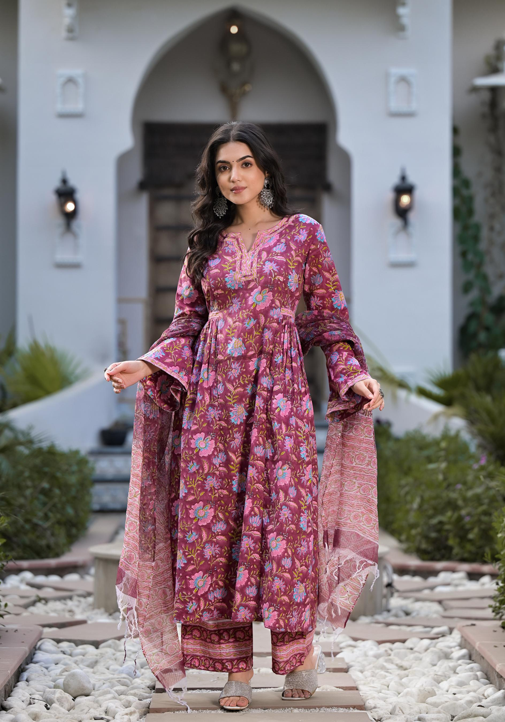 Woman in Magenta Hand Block Floral Printed Cotton Kurta Set with bell sleeves and shawl