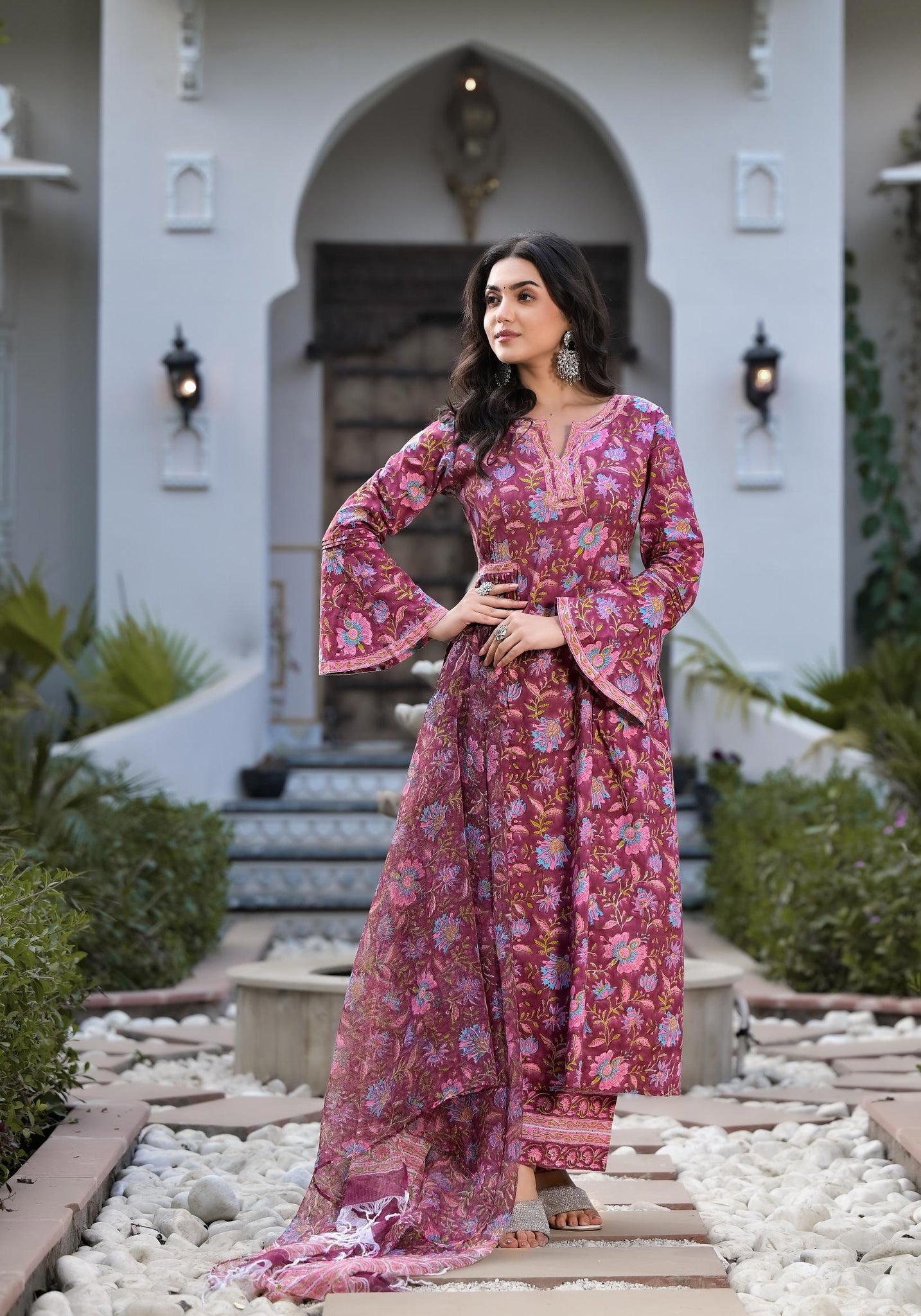 Woman in vibrant pink floral patterned long dress from Magenta Hand Block Cotton Kurta