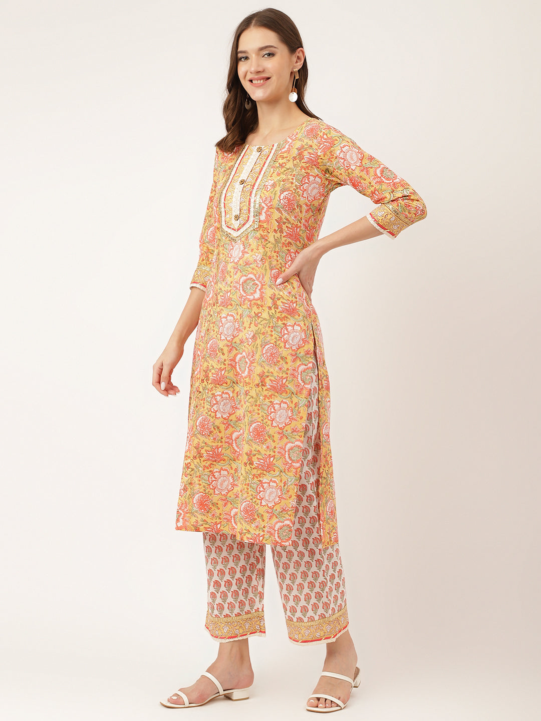 Woman in a colorful hand block floral print cotton kurta and palazzo pants set