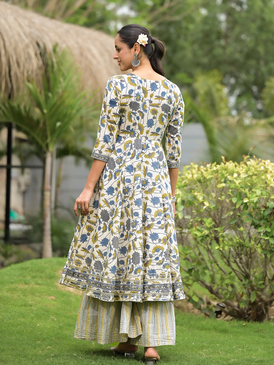 Floral Print Cotton Kurta Sharara Set styled with Striped Palazzo Pants outdoors