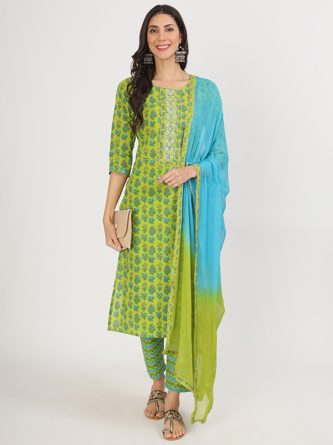 Woman in green floral print cotton kurta pants and dupatta set by Unicorn Fashion