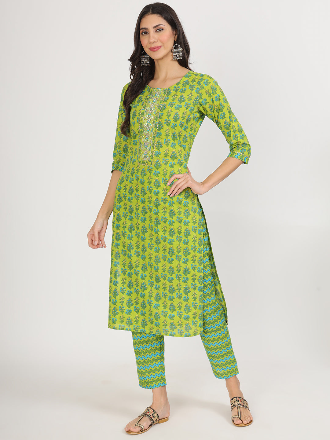 Bright green floral print cotton kurta pants set worn by a woman from Unicorn Fashion