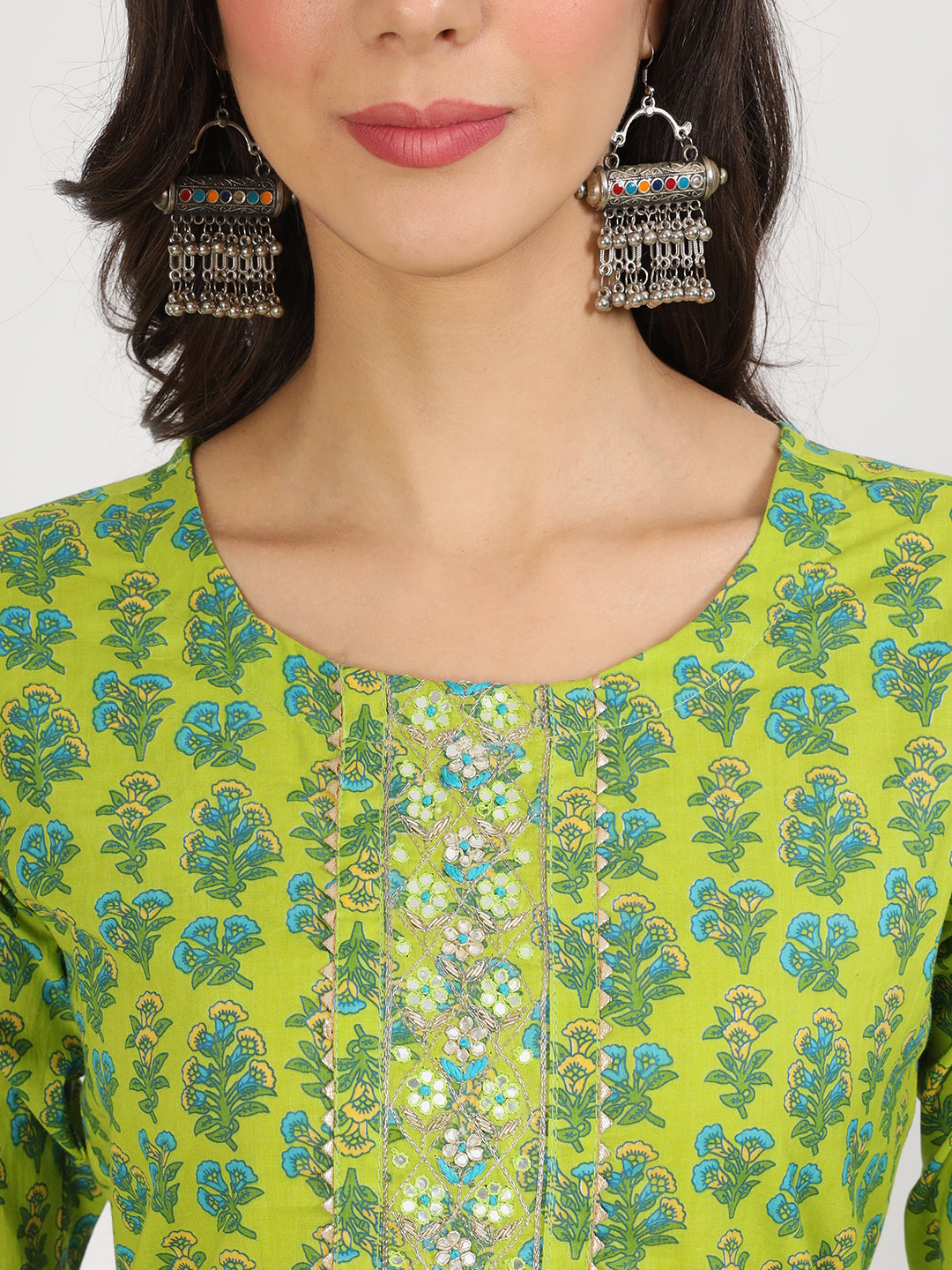 Ornate silver chandelier earrings with turquoise accents for floral print cotton kurta pants